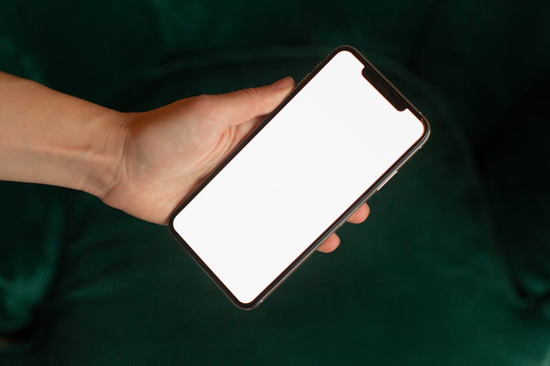user holding smartphone while testing vibration patterns with visual feedback on screen