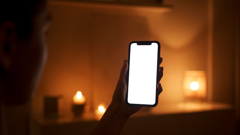 side by side comparison of clean screen vs screen with light leakage in dark room