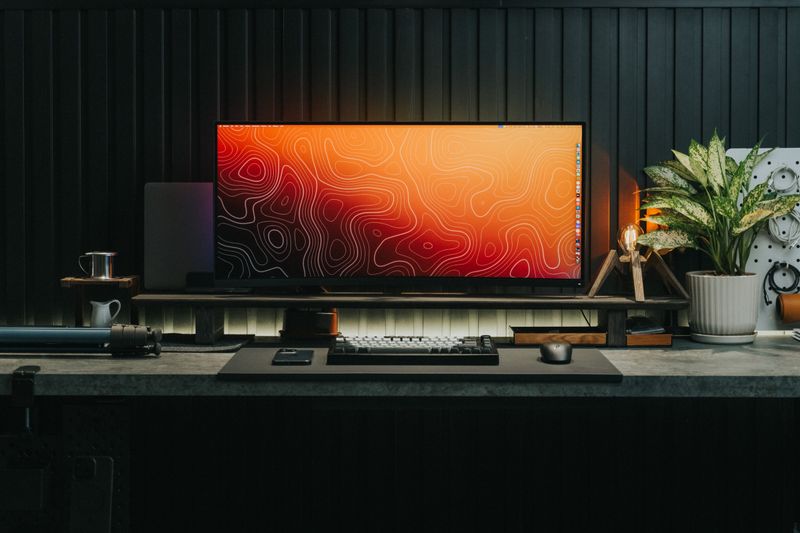 close up computer monitor screen showing dead pixel and backlight bleed